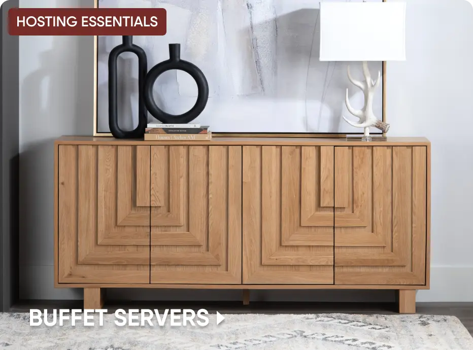 HOSTING ESSENTIALS BUFFET SERVERS: A light wood buffet cabinet with geometric door detailing, styled with decor.