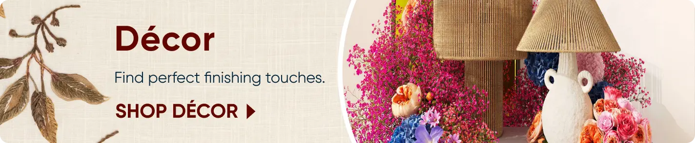 Décor: Find perfect finishing touches. SHOP DÉCOR. A decorative lamp and vase surrounded by vibrant pink flowers.