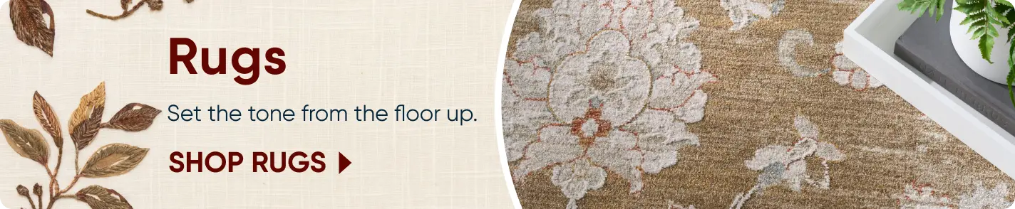 Rugs: Set the tone from the floor up. SHOP RUGS. A close-up of a floral patterned rug with a decorative tray.