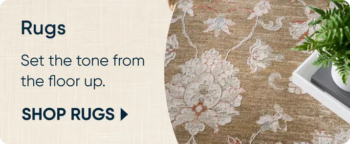 Rugs: Set the tone from the floor up. SHOP RUGS. A close-up of a floral patterned rug with a decorative tray.