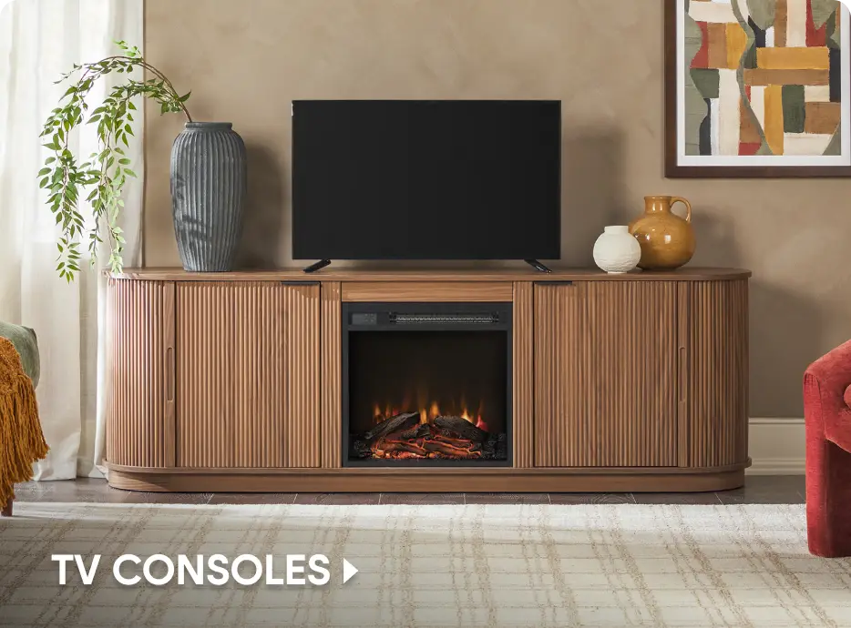 TV CONSOLES. A modern, fluted wood TV console with an integrated electric fireplace, topped with a TV and decor.