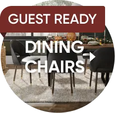 GUEST READY DINING CHAIRS: A set of modern black dining chairs with wooden legs arranged around a dining table.