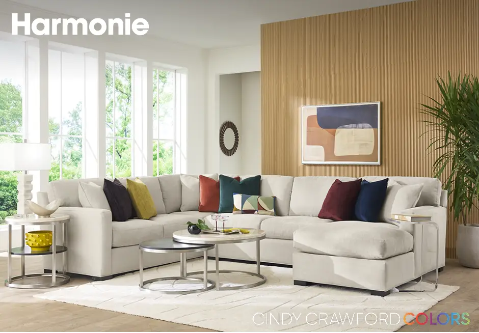 Harmonie. A sectional sofa with colorful pillows.
