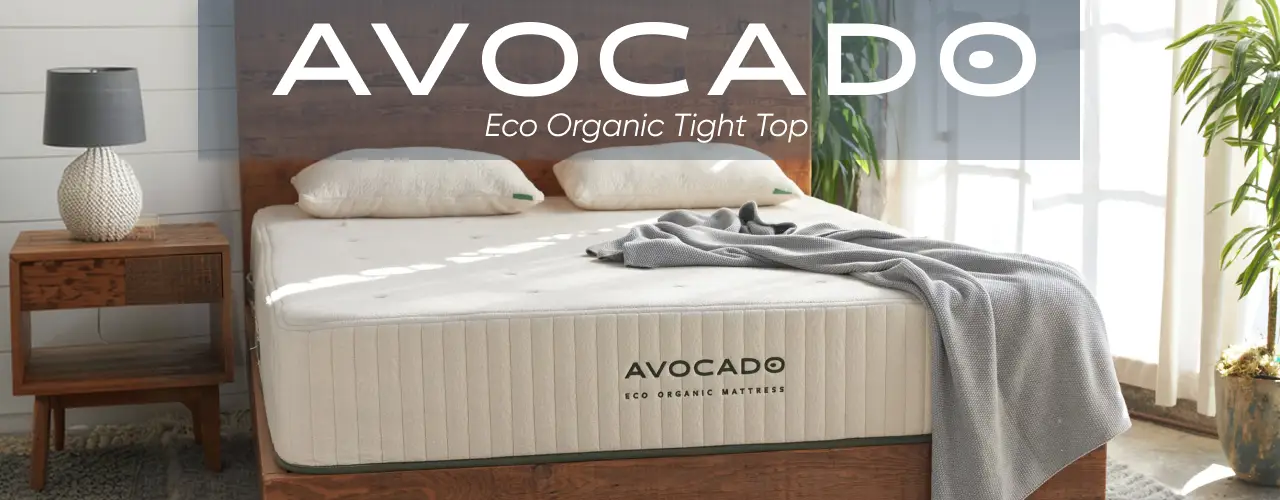 AVOCADO Eco Organic Tight Top mattress on a wooden bed frame in a bright, modern bedroom.