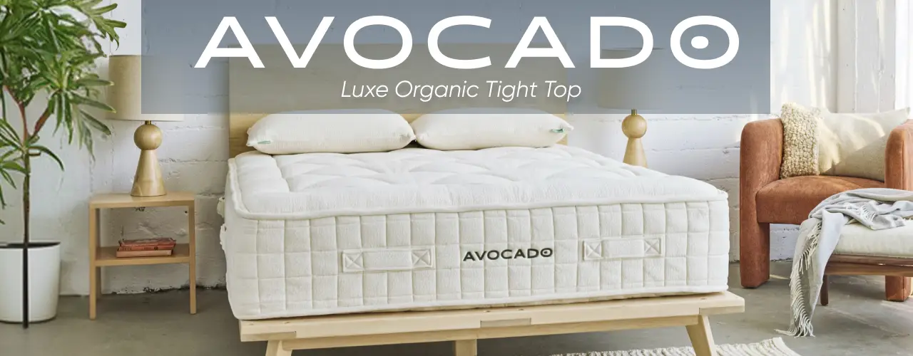 AVOCADO LUXE ORGANIC TIGHT TOP. An Avocado organic mattress on a wooden bed frame in a bright, modern bedroom.