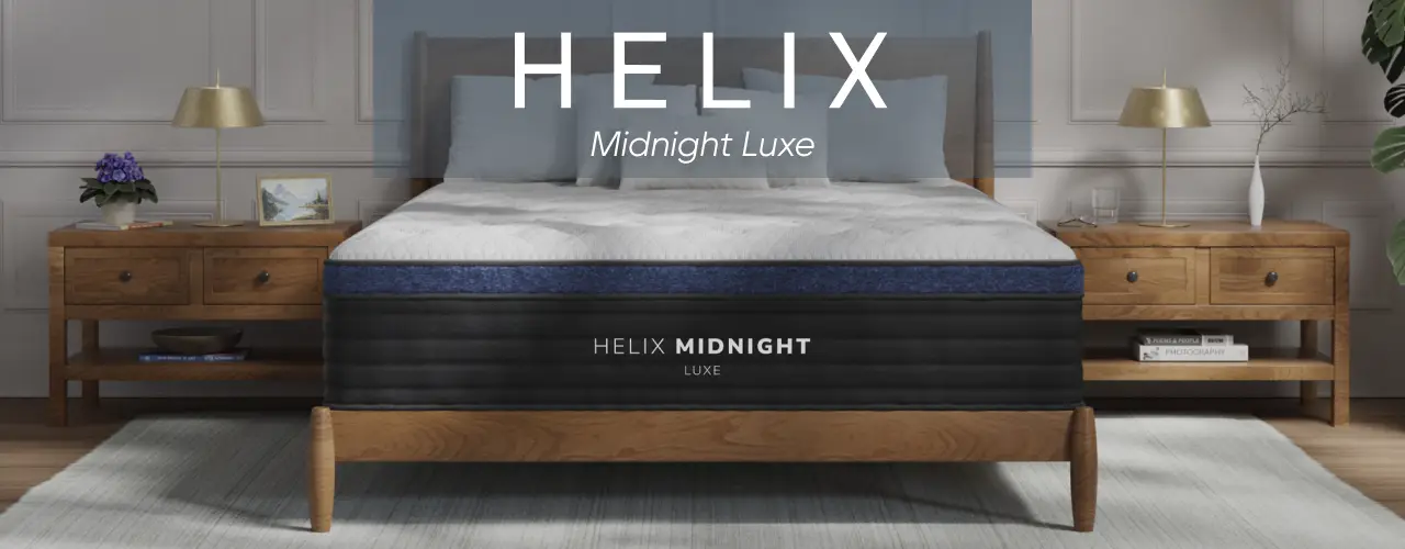 Helix Midnight Luxe mattress on a wooden bed frame in a bedroom setting.