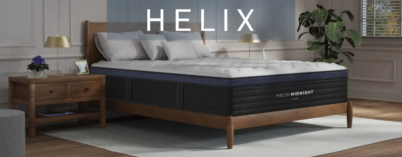 HELIX: A Helix Midnight Luxe mattress on a wooden bed frame in a modern bedroom.