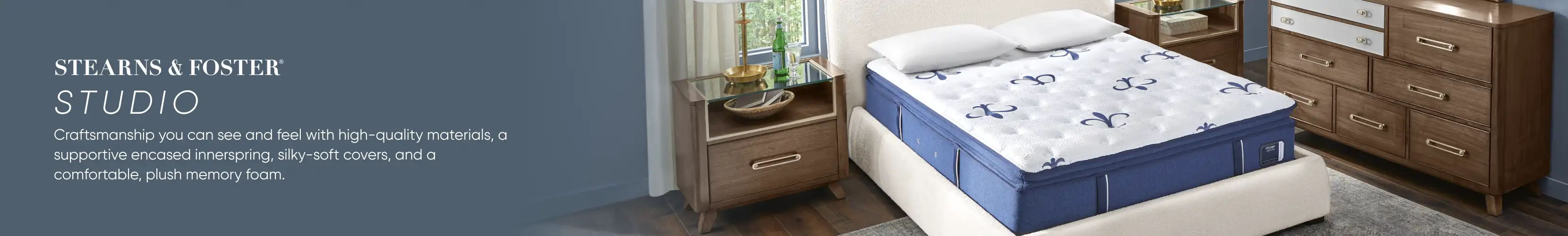 STEARNS & FOSTER STUDIO. A bed with a mattress, nightstand, and dresser.
