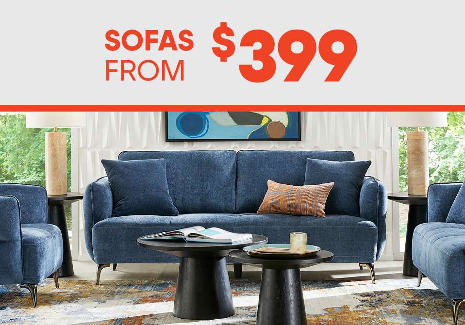 SOFAS FROM $399. A blue sofa with two matching armchairs, two black side tables, and a coffee table.
