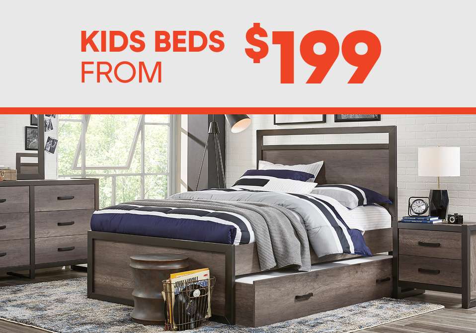 KIDS BEDS FROM $199. A bedroom set with a bed, dresser, and nightstand.
