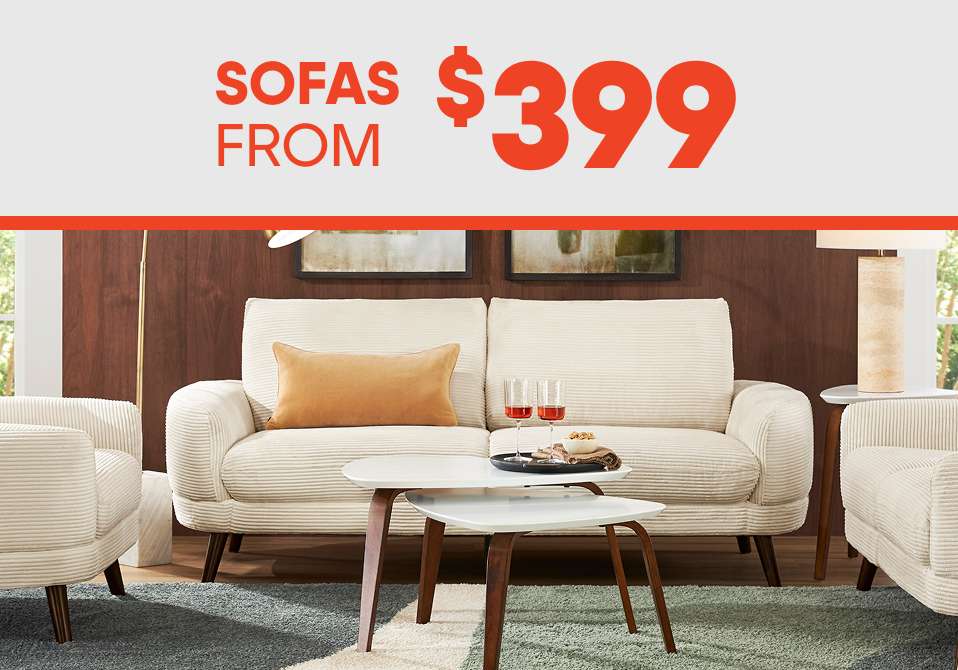 SOFAS FROM $399. A cream-colored sofa with a matching armchair and coffee table.
