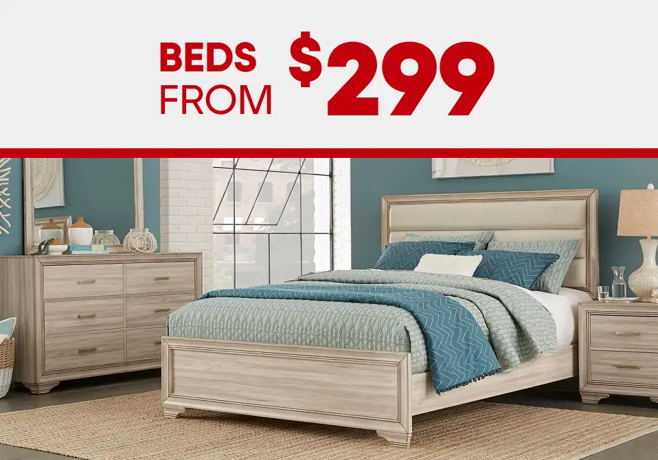 BEDS FROM $299. A bedroom set with a bed, dresser, and nightstand.
