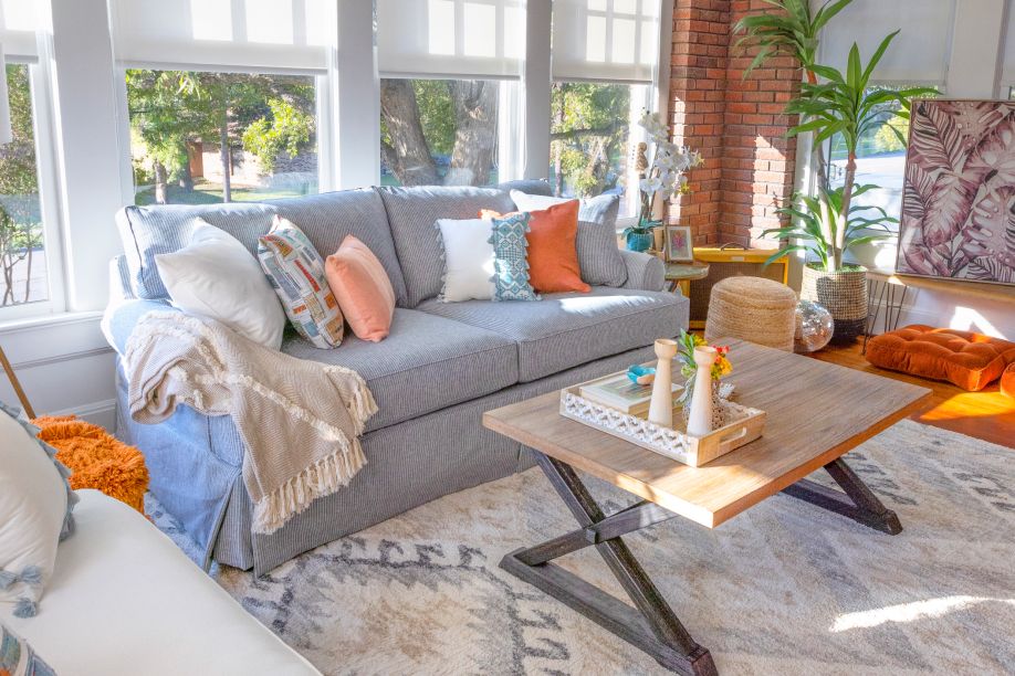 blue couch with brown table