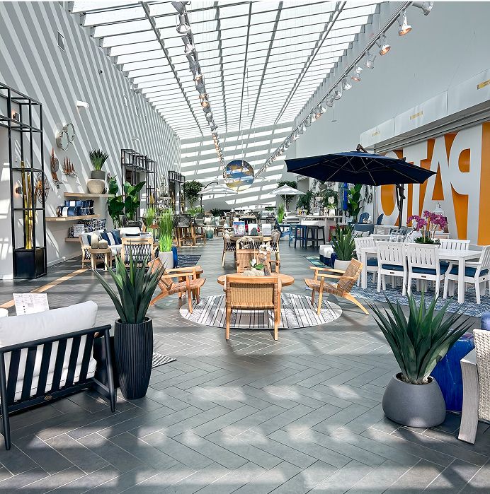 Patio furniture display in a showroom.
