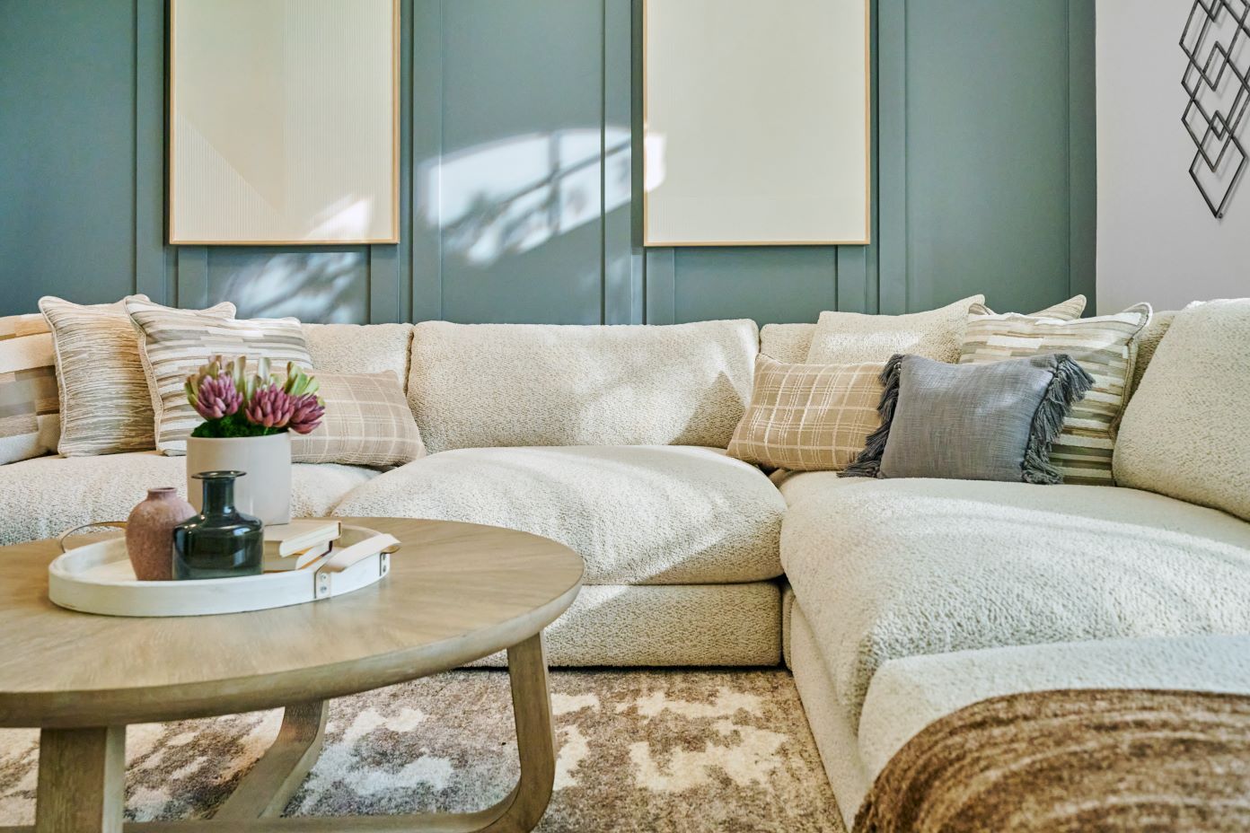 light colored couch with tables 
