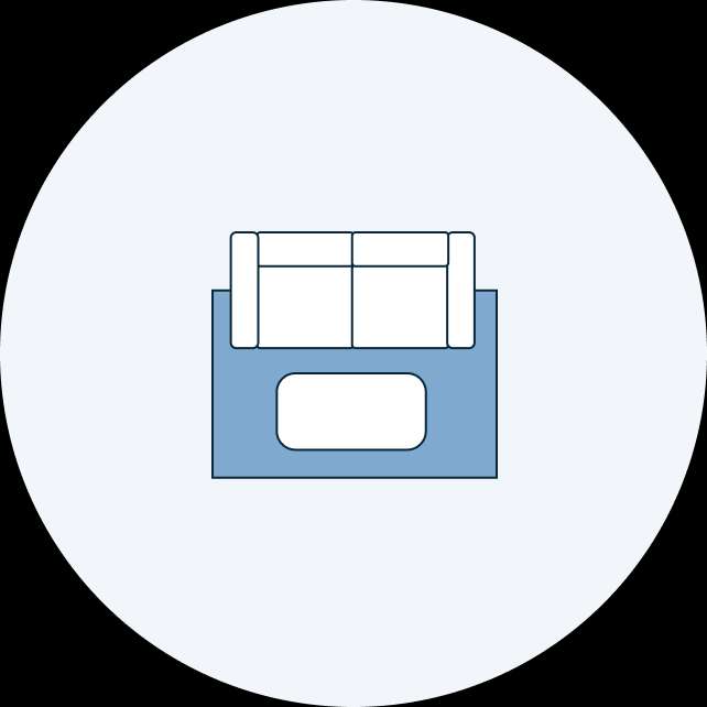 A blue sofa with a white cushion inside a light blue circle.
