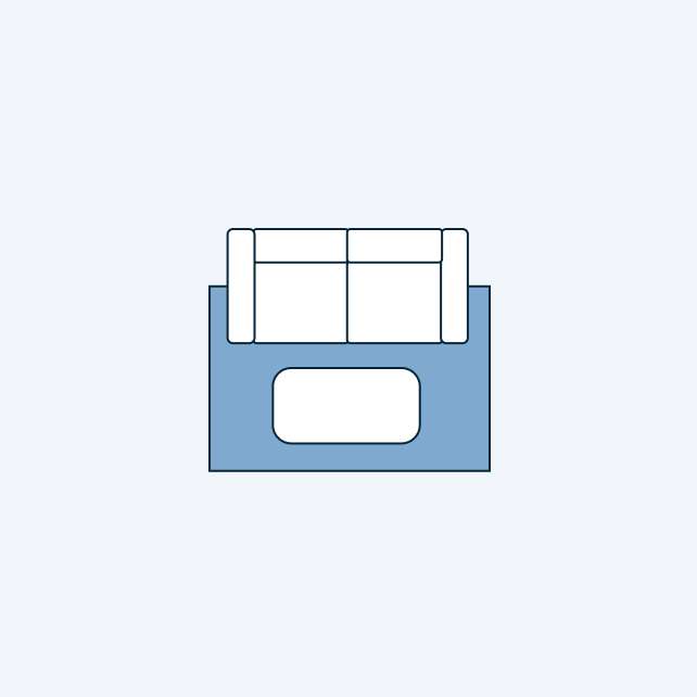 Top-down view of a blue sofa with a white cushion.
