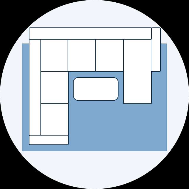 Top-down view of a sectional sofa and a rectangular coffee table on a blue rug.

