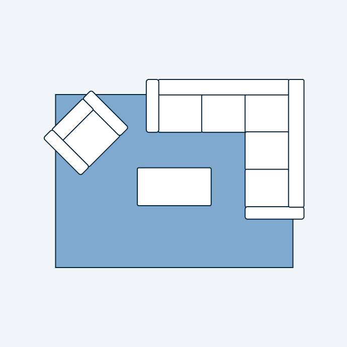 Floor plan of a living room with a sectional sofa, armchair, and coffee table on a rug.
