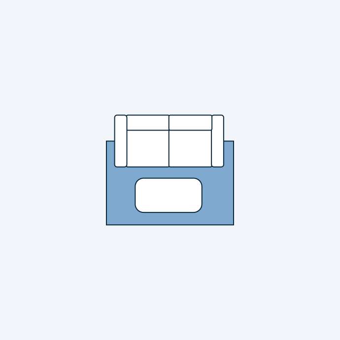 Top-down view of a blue sofa with a white coffee table.
