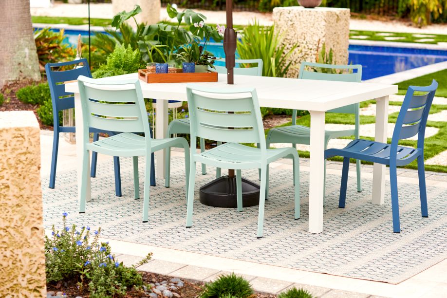 blue and white table with large rug underneath