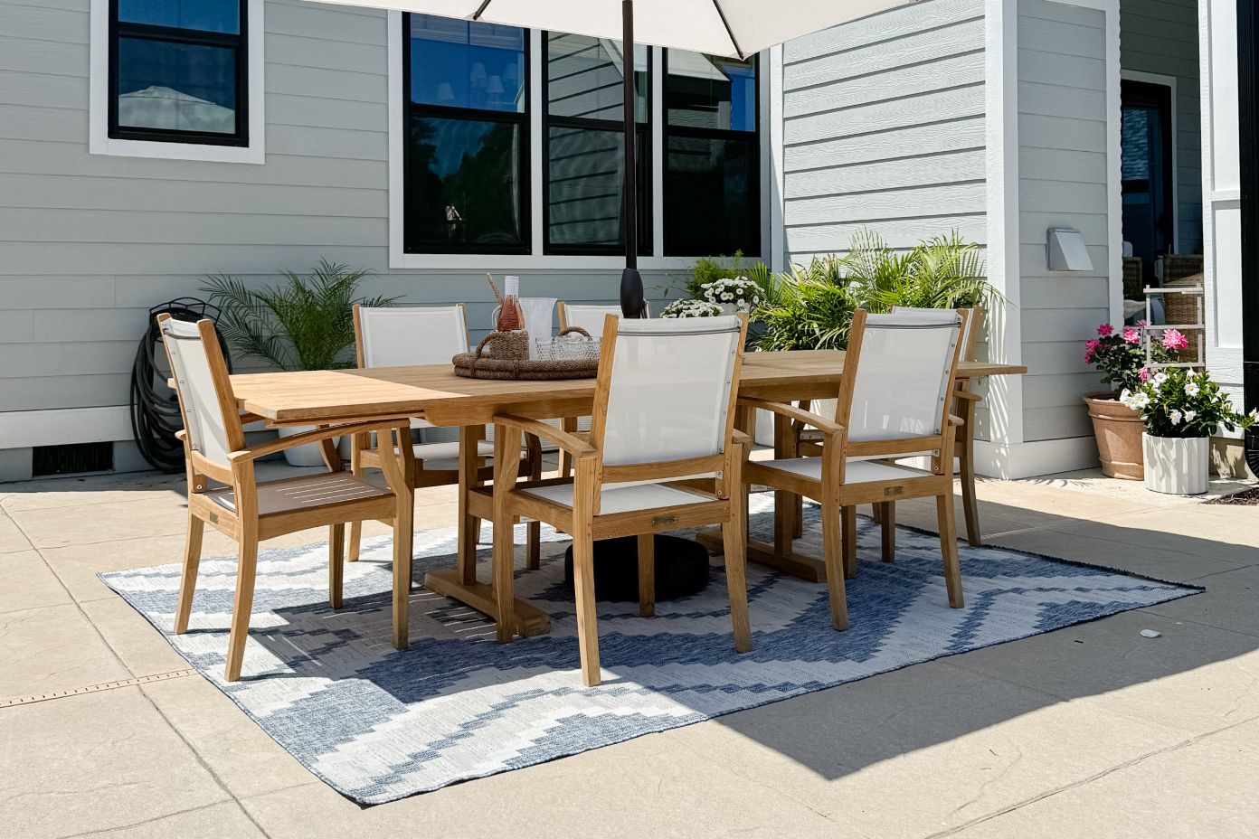 blue and white rug under a brown table