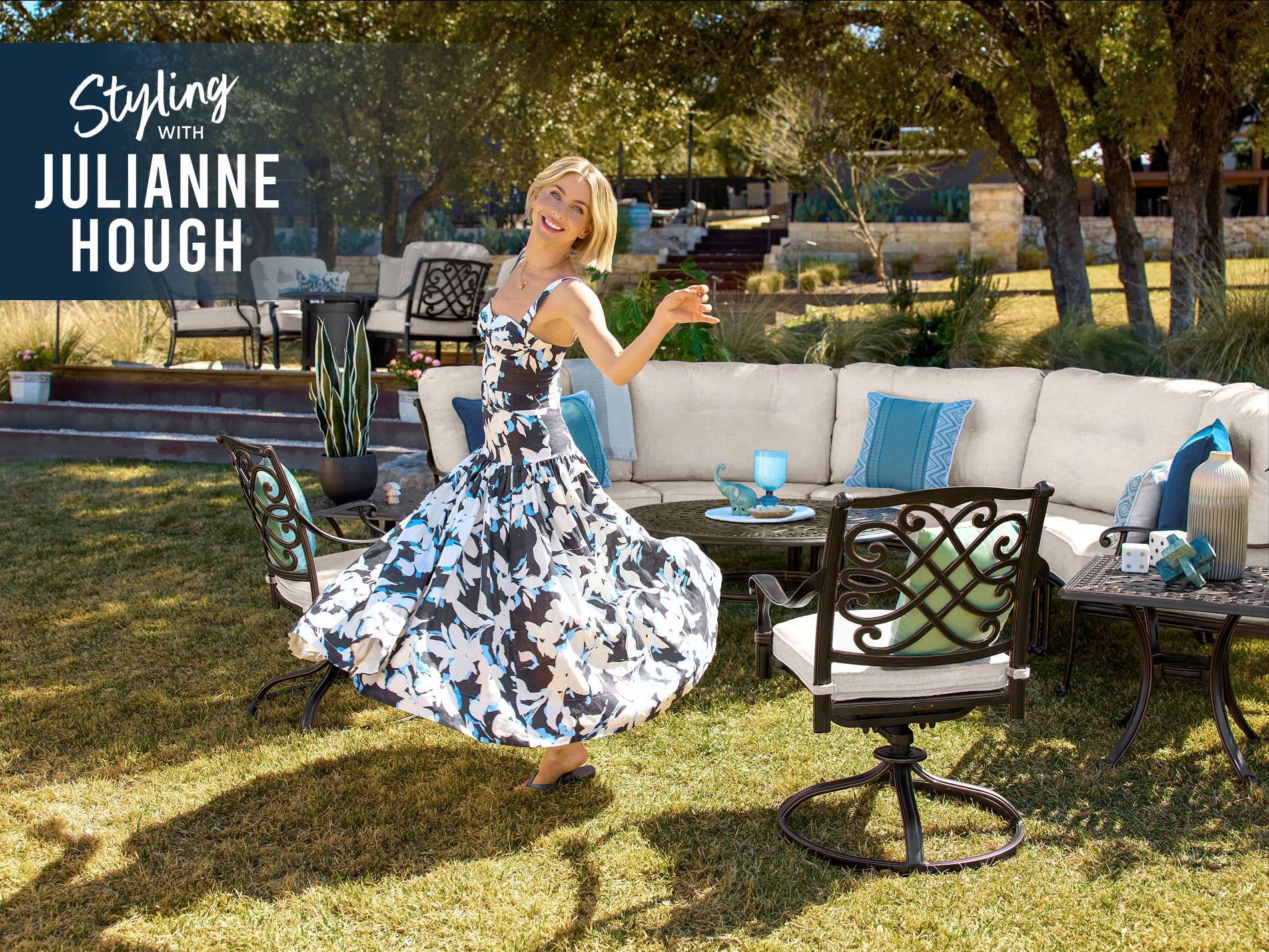 Styling with Julianne Hough. A woman in a floral dress dances in a backyard with outdoor furniture.
