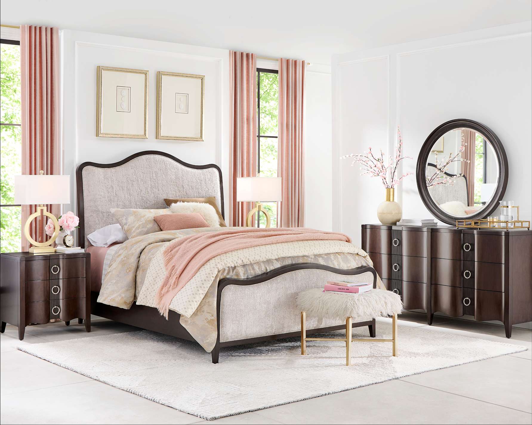 Bedroom furniture set with a bed, nightstands, and a dresser.
