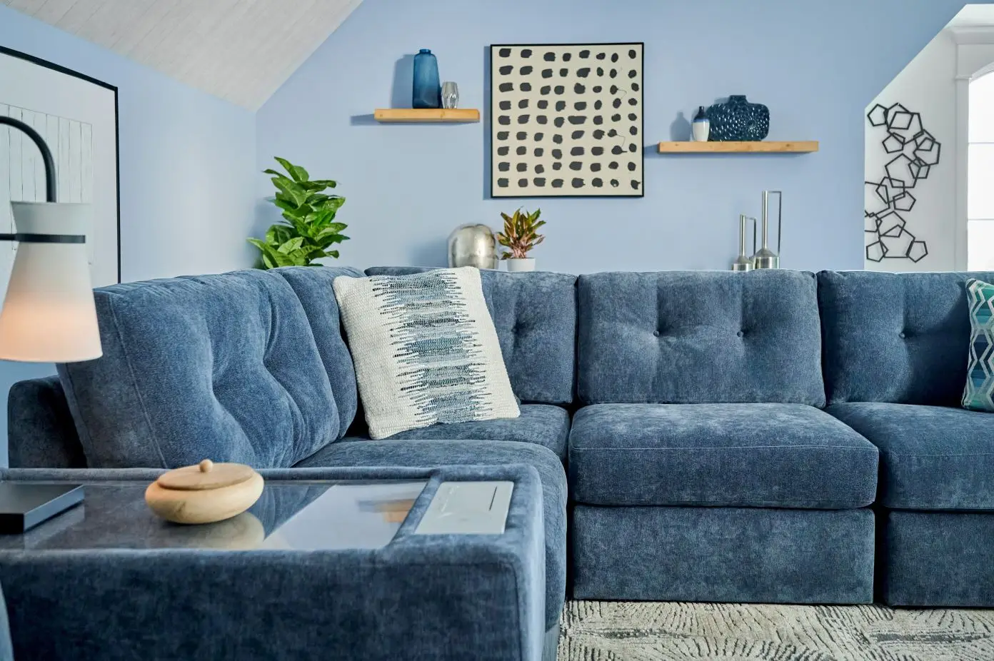 Blue sectional sofa in a living room.
