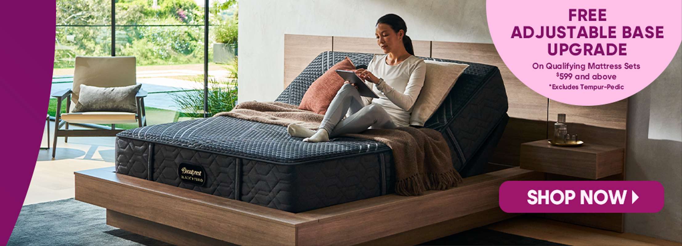 FREE ADJUSTABLE BASE UPGRADE. Shop Now. A woman on a bed with a mattress.

