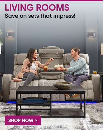 LIVING ROOMS. Save on sets that impress! A couple sitting on a modern sofa, eating popcorn.

