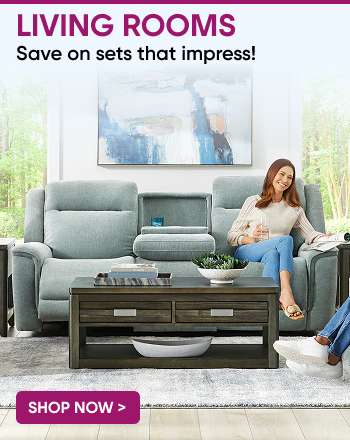 LIVING ROOMS. Save on sets that impress! A woman sits on a blue sofa in a living room.
