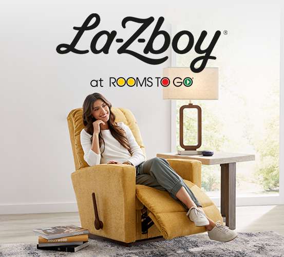 La-Z-Boy at Rooms To Go. A woman sits in a yellow recliner.
