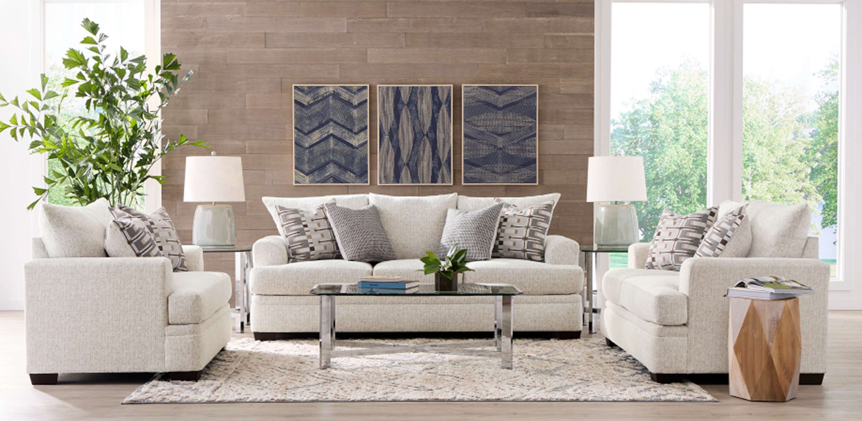 Living room with a sofa, two armchairs, and a coffee table.
