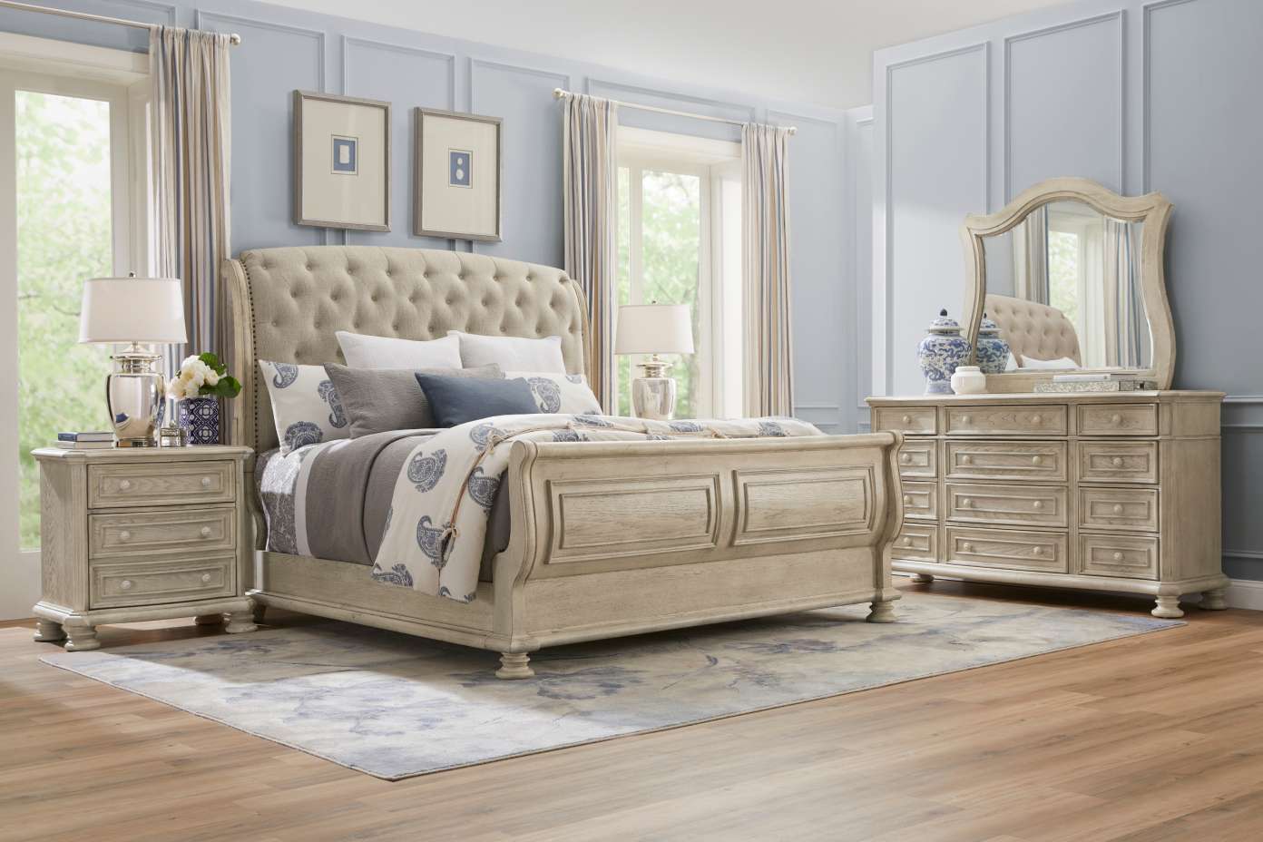 Bedroom furniture set with a bed, nightstands, and dresser.
