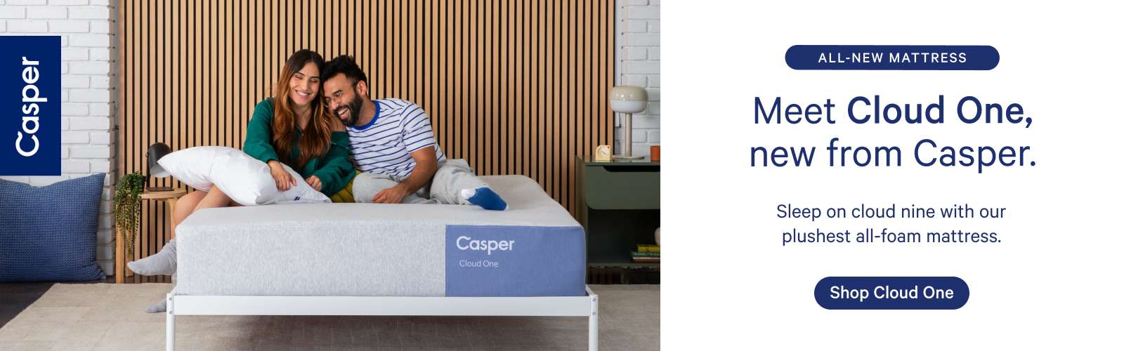 Casper Cloud One mattress with a couple sitting on it.
