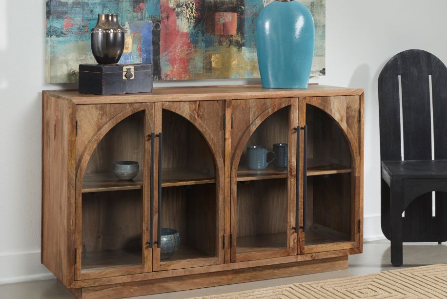 Wooden cabinet with glass doors and arched design.

