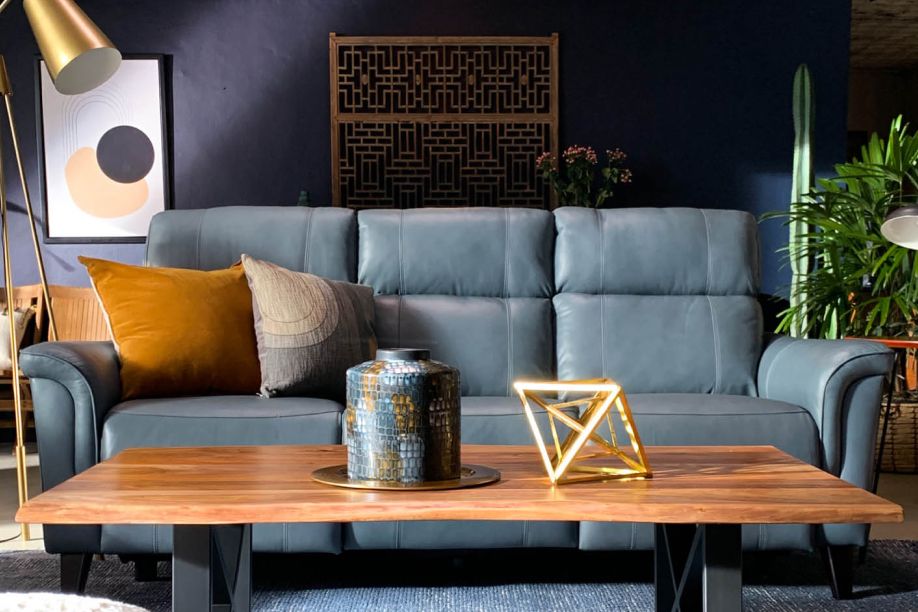 blue couch with brown coffee table