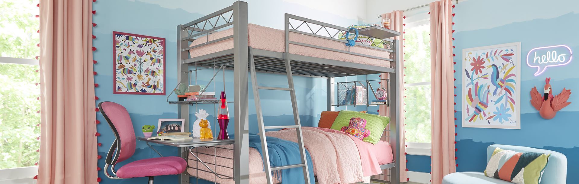 A bedroom with a bunk bed, desk, and colorful decorations.
