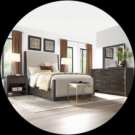 Bedroom furniture set with a bed, nightstand, dresser, and bench.
