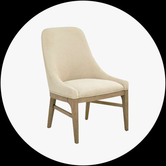 Upholstered dining chair with a light wood frame.
