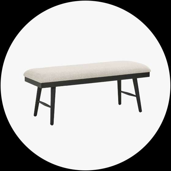 Upholstered bench with black legs.
