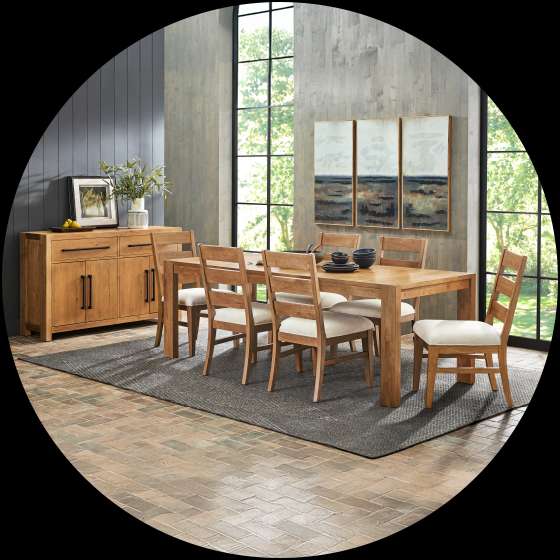 Dining room set with a wooden table, chairs, and a sideboard.
