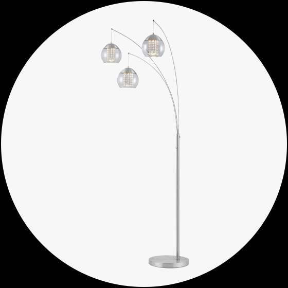 Silver arc floor lamp with three glass globe shades.
