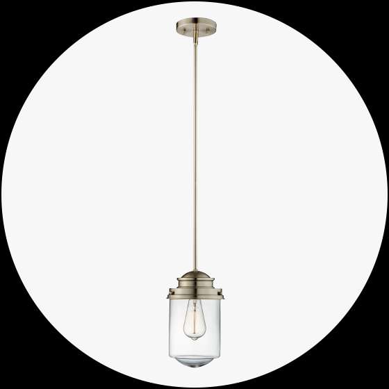 A brushed nickel pendant light with a clear glass shade.
