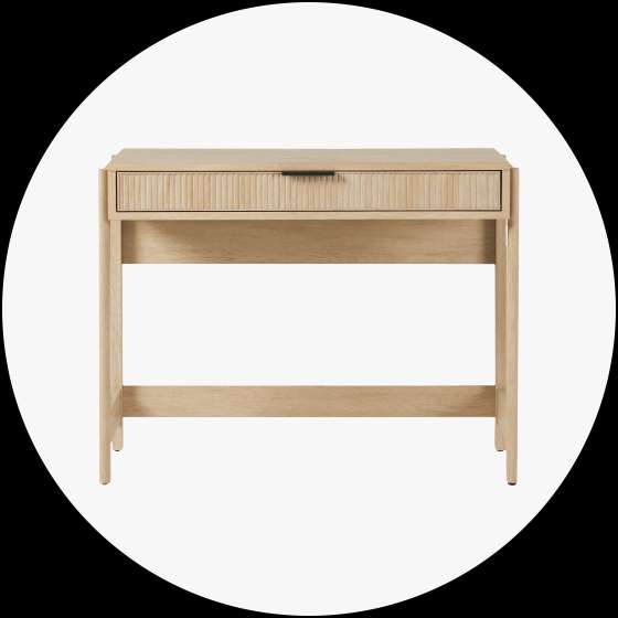 Wooden desk with a drawer and ribbed front.
