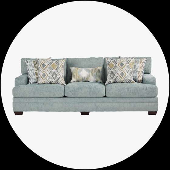 Light blue sofa with patterned pillows.
