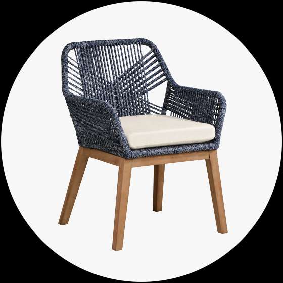 Blue woven outdoor chair with a cream cushion and wooden legs.
