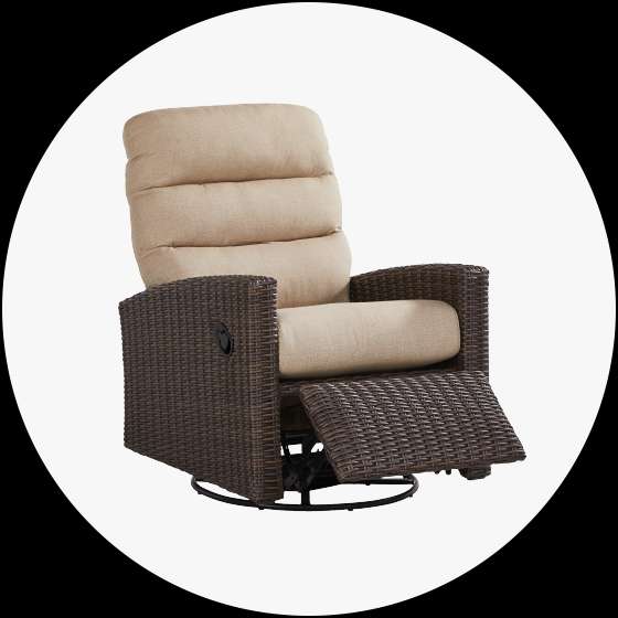 Brown wicker recliner chair with tan cushions.
