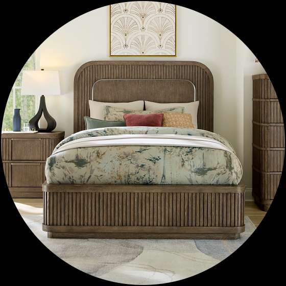 Bedroom set with a bed, nightstand, and dresser.
